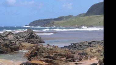 Waves breaking at Leao Beach on the winter season, Fernando de Noronha archipelago, Brazil. High quality FullHD footage