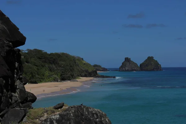 View of Two Brothers Mountain - Morro dos Dois Irmaos in Portuguese - during a sunny morning in Fernando de Noronha, Brazil. High quality photo