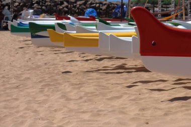 Hawaiian canoes laying on Porto beach, Fernando de Noronha. High quality photo
