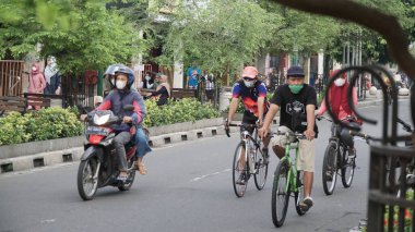 The situation of Malioboro Street in the morning with street seller and visitor