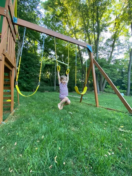 Young Boy Playground Rings Swinging Happy — Stock Photo, Image