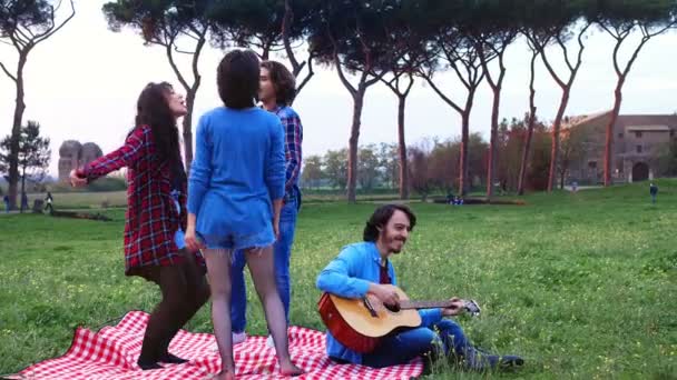 Slow Motion Four Friends Park Having Picnic Dancing Singing Accompanied — Stock Video