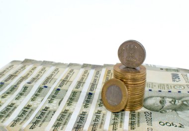 10 rupees coin mixed with 500 rupees. India
