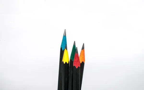 Close-up of lead pencils, colourful pencil on white paper background. Selective focus