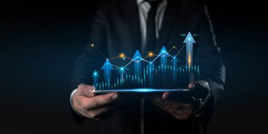 businessman using the tablet with financial graph background, Business Trading concept