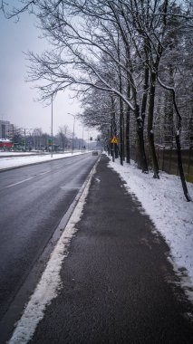Cleared from snow sidewalk in winter 