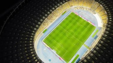 Night top down aerial view of Soccer stadium in downtown Kyiv, Ukraine. Tourism landmark of city. Soccer field. Football stadium. Football field arena. High quality 4k footage