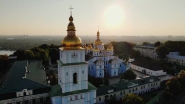 Fly over St. Michaels Golden-Domed Monastery on Mykhailivska Square to Dnipro River in Kyiv, Ukraine, Kyiv - 10 august 2021. High quality 4k footage