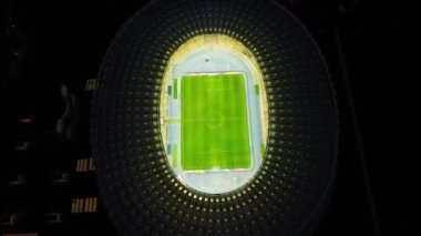 Night top down aerial view of downtown Kyiv, Ukraine. Tourism landmark of city. Soccer field. Soccer stadium. Football stadium. Football field arena. High quality 4k footage
