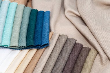 Cotton fabric stacked in layers. Natural fabric for sewing clothes and bed line