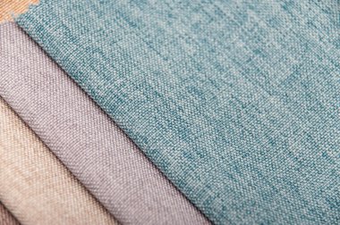 Cotton fabric stacked in layers. Natural fabric for sewing clothes and bed line