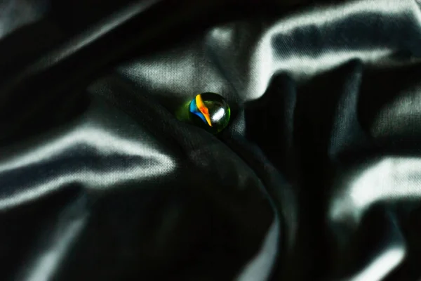 balloon on a black background with a yellow and blue glow