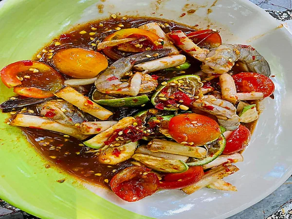 Papaya salad with fresh shrimp, spicy salad, Thai food, the most delicious