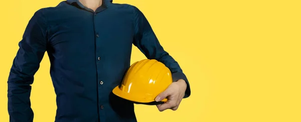 Engineer Blue Shirt Helmet Yellow Background Safety First — Fotografie, imagine de stoc