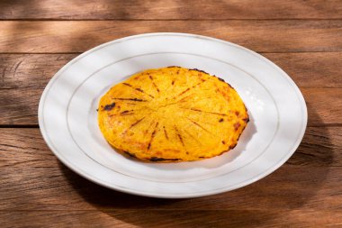 Arepa of ground corn - Traditional Colombian food clipart