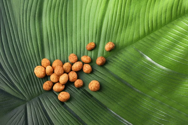 Organic japanese peanuts on the green leaf - Arachis hypogaea