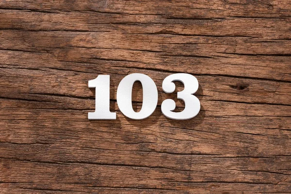 Číslo 103 Kus Rustikálním Dřevěném Pozadí — Stock fotografie