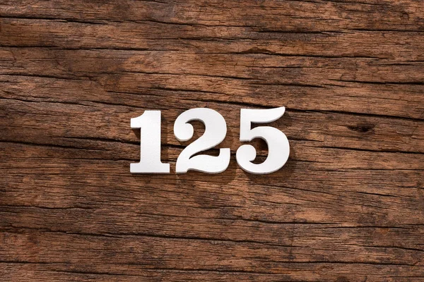 Numéro 125 Pièce Sur Fond Bois Rustique — Photo
