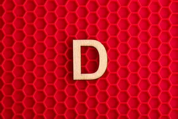 Capital Letter White Piece Silicone Background Red Hexagons — Stockfoto