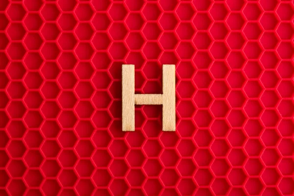 Capital Letter White Piece Silicone Background Red Hexagons — Stock Photo, Image