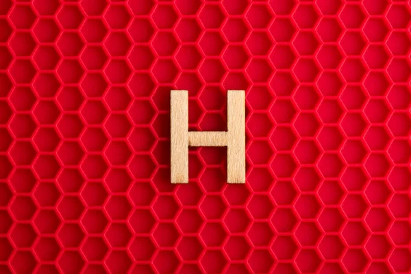 Capital Letter White Piece Silicone Background Red Hexagons — Stockfoto