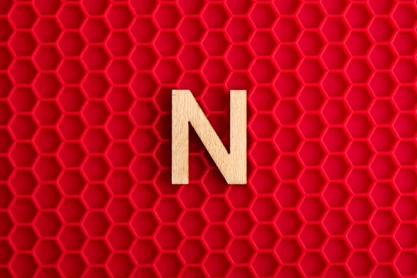Capital Letter White Piece Silicone Background Red Hexagons — ストック写真
