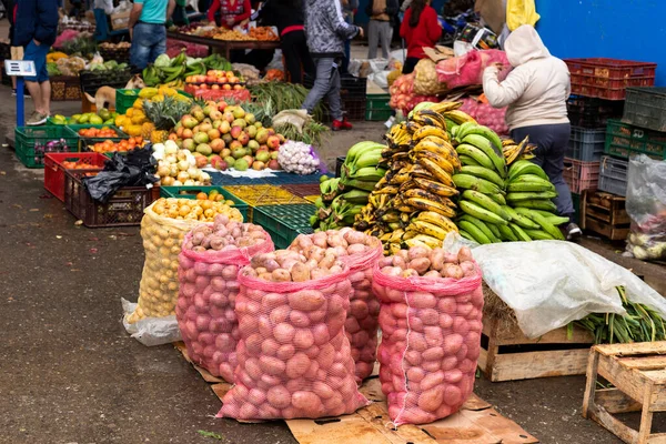 Display of fruits and vegetables in a traditional Colombian market square