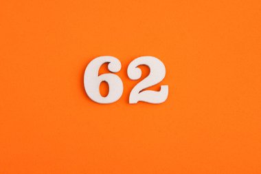 White wooden number 62 on eva rubber orange background