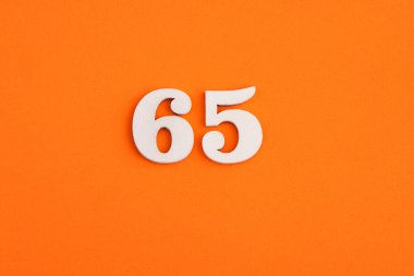 Number 65 - On orange foam rubber background