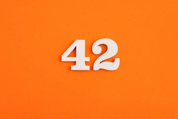 White Wooden Number Eva Rubber Orange Background — Φωτογραφία Αρχείου