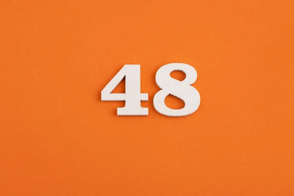 White Wooden Number Eva Rubber Orange Background — Stok fotoğraf