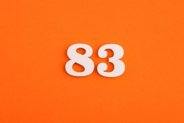 Number 83 - On orange foam rubber background