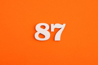 Number 87 - On orange foam rubber background