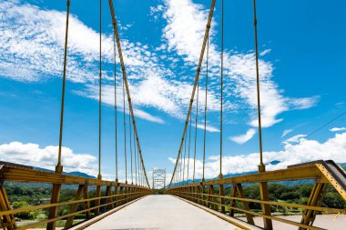 Yellow bridge over Cauca river in Santa Fe de Antioquia, Colombia