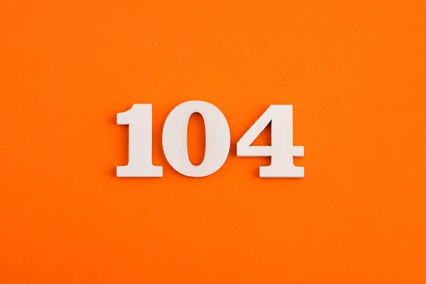 White Wooden Number 104 Eva Rubber Orange Background — Stock Fotó