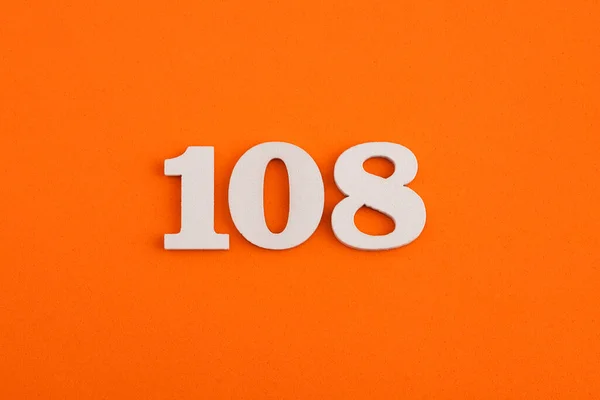 White Wooden Number 108 Eva Rubber Orange Background — Photo