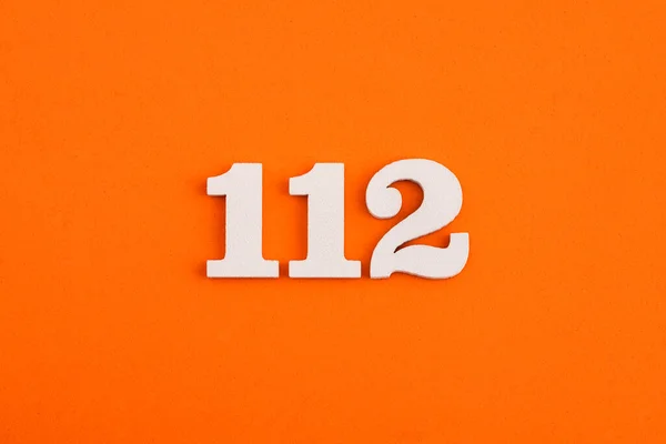 White Wooden Number 112 Eva Rubber Orange Background — Stockfoto