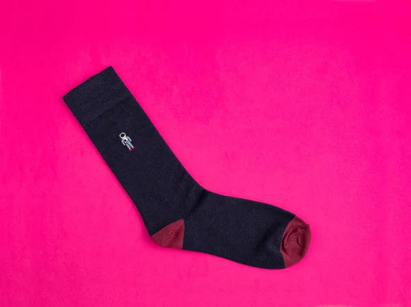 Dark blue sock with astronaut - Fuchsia background