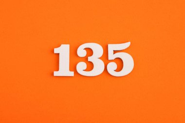 Number 135 - On orange foam rubber background