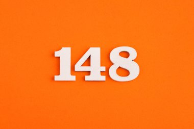White wooden number 148 on eva rubber orange background