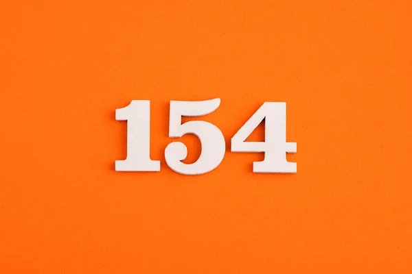 White Wooden Number 154 Eva Rubber Orange Background — Zdjęcie stockowe