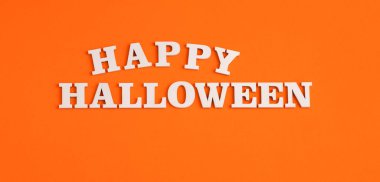 Happy halloween - title in letters on orange background
