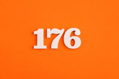White wooden number 176 on eva rubber orange background