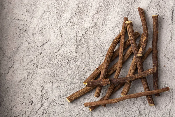 Close up of Ayurvedic herb Liquorice root,Licorice root, Mulethi or Glycyrrhiza glabra root on a wooden surface is very much beneficial for Soothes your stomach,poisoning, stomach ulcers