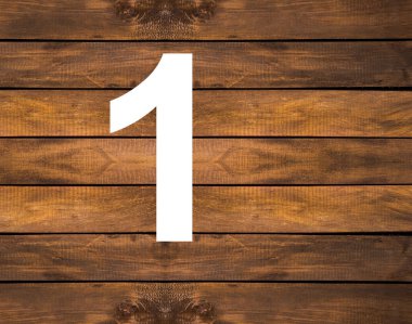 Tahta arka planda beyaz bir delik var.