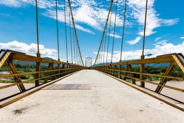 Yellow bridge over Cauca river in Santa Fe de Antioquia, Colombia
