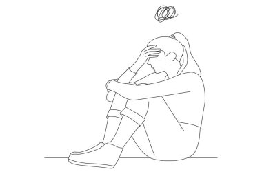 woman frustrated by problem with work or relationships, embracing knees, covered face in hand