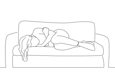 ad depressed woman with crossed arms lying on couch at home crying, feeling loneliness.