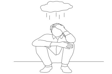 depressed man sitting against a white wall at home with a shadow on the wall feeling miserable