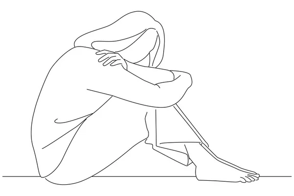 sad woman with depression sitting alone on the floor major depressive disorder. 